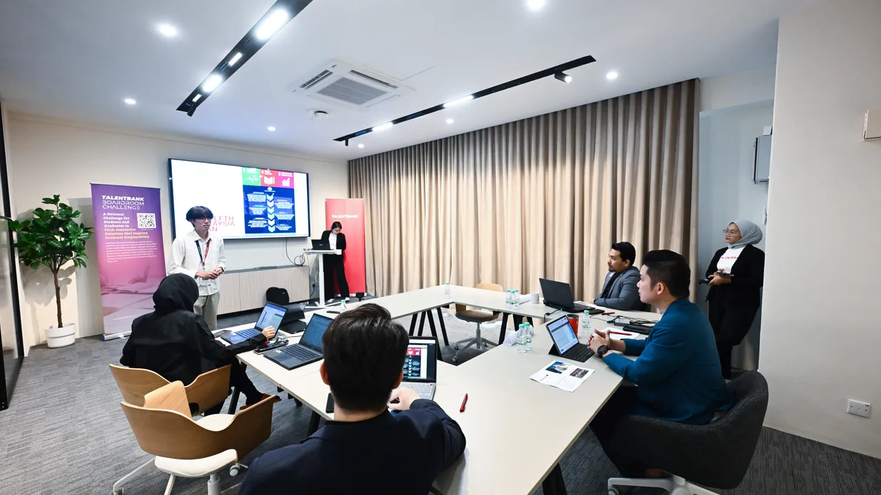 A team presenting to a judging panel seated around a U-shaped table in a meeting room