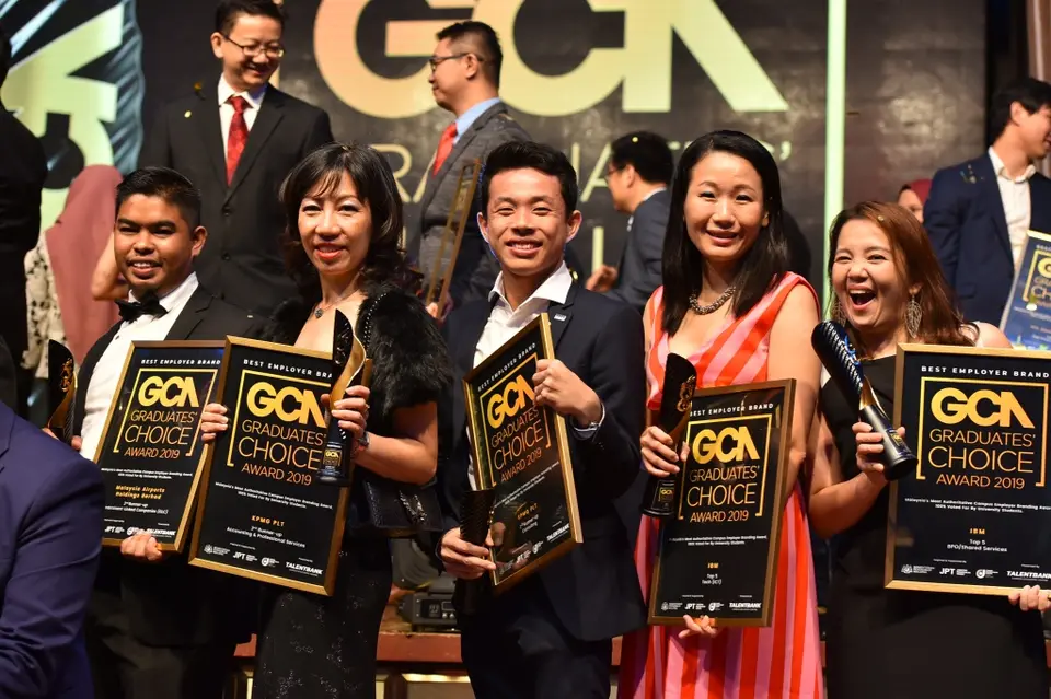 Winners holding their awards in 2019