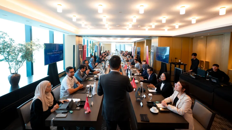 People around a long boardroom table during the Graduates' Choice Award audit