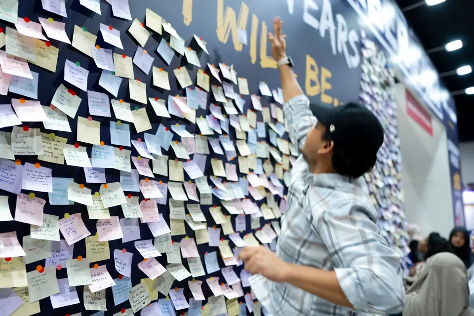 Visitors write their goals on the wall, 2026