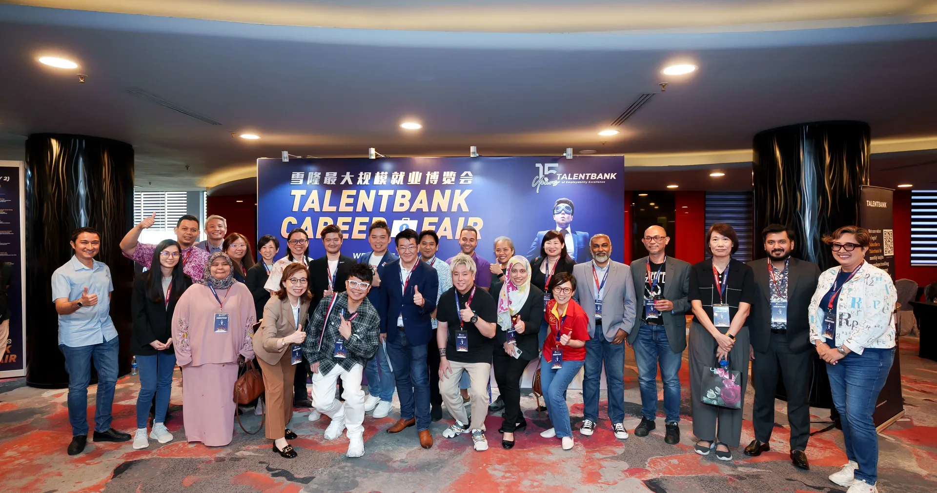 Mentors and the Talentbank team gathered for a group photo in front of the Talentbank Career Fair backdrop