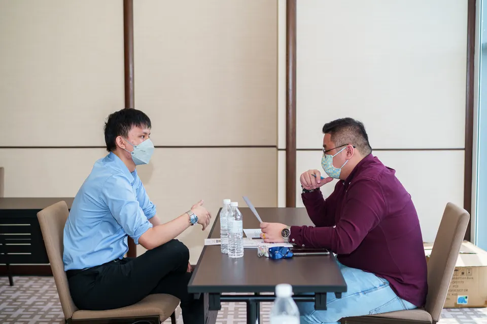 Two people in an interview at a table